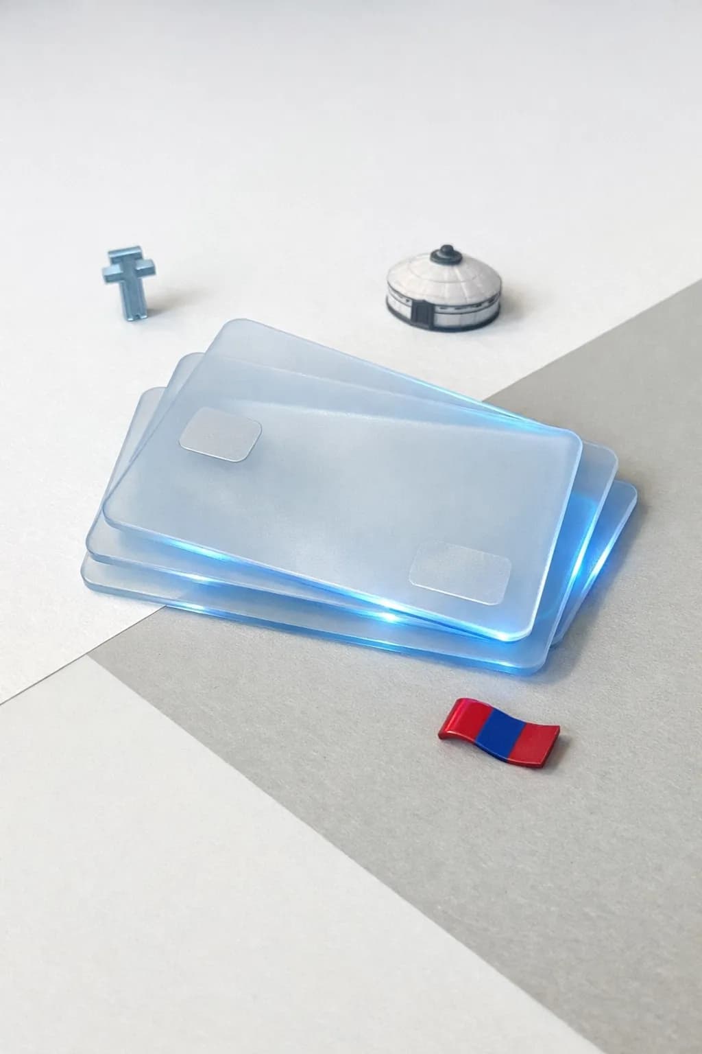 Stacked glass payment cards with a tugrik symbol, yurt silhouette, and Mongolian flag