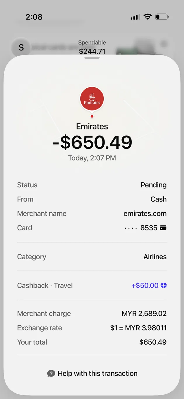Plasma One transaction detail for a 650.49 dollar Emirates flight purchase showing the Airlines category and 50 dollars of pending Travel cashback